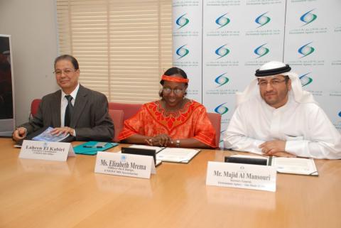 H.E. Majid Al Mansouri Elizabeth Mrema and Lahcen El Kabiri during the signing ceremony