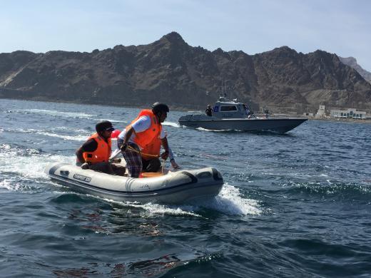 Trainees practice entanglement response on the water using boats and ropes to simulate entangled whales. 